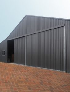 Corrugated metal building with large sliding doors
