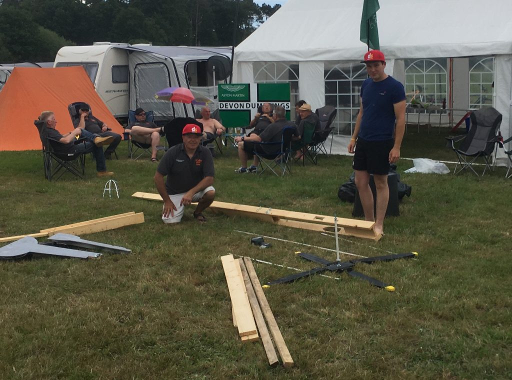 Men at campsite preparing to build a replica spitfire